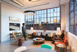 Young people gathered in loft living space Young people gathered in loft living space
