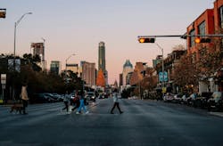 People crossing city street in Austin, Texas People crossing city street in Austin, Texas