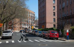 Thwaites Place street view with woman walking Thwaites Place street view with woman walking