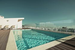 Ocula frameless windscreen beside pool Ocula frameless windscreen beside pool