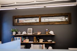 Wood trim from the repurposed barn in a Mortenson Construction workspace Wood trim from the repurposed barn in a Mortenson Construction workspace