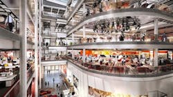 Work spaces and amenities overlooking the full-height atrium in the BBC Wales HQ Work spaces and amenities overlooking the full-height atrium in the BBC Wales HQ