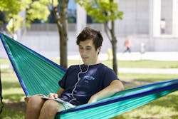 Student sitting in a hammock Student sitting in a hammock