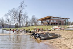 People carrying a boat in front of the Clemson's Outdoor Education Center People carrying a boat in front of the Clemson's Outdoor Education Center