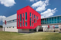 PAC-CLAD Highline S1 metal wall panel system clads Del Valle Career & Tech Center in 3 shades of red PAC-CLAD Highline S1 metal wall panel system clads Del Valle Career & Tech Center in 3 shades of red