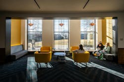 The building's lobby features new furniture and large windows The building's lobby features new furniture and large windows
