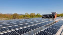 Solar panels on rooftop of multifamily building Solar panels on rooftop of multifamily building
