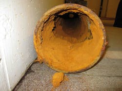 Figure 3 – Iron Ochre Buildup in Sub-Grade Drainage System Pipe Figure 3 – Iron Ochre Buildup in Sub-Grade Drainage System Pipe