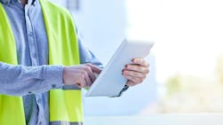 Construction worker holding iPad Construction worker holding iPad