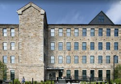 Adaptive reuse project Stone Mill Lofts transforms 1840s-era mill building into rental housing. Photo: The Architectural Team, Inc. (TAT) Adaptive reuse project Stone Mill Lofts transforms 1840s-era mill building into rental housing. Photo: The Architectural Team, Inc. (TAT)