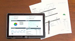 Ipad and paper report analysis stock image