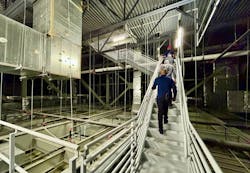 Workers climbing stairs. FOS photo Workers climbing stairs. FOS photo