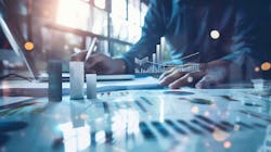 Person working with graphs and charts Person working with graphs and charts