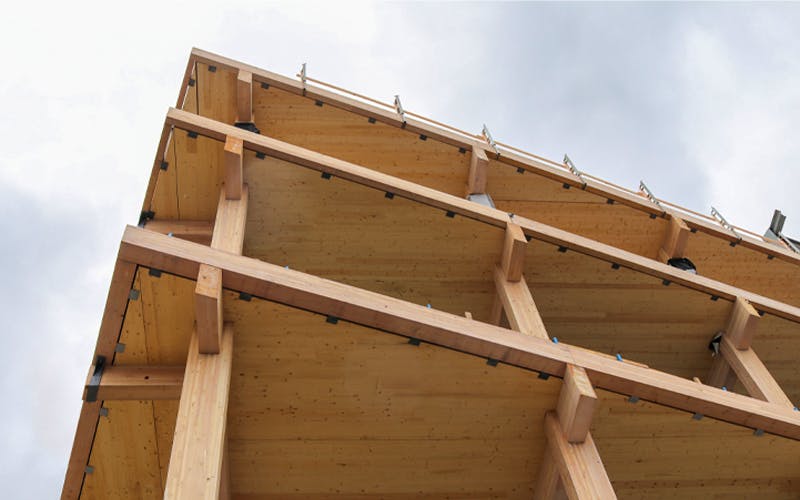 Glulam beams and CLT panels used in a nonresidential structure.