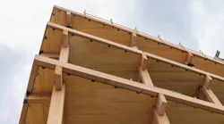 Glulam beams and CLT panels used in a nonresidential structure.