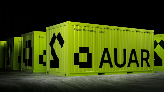 Shipping container-size factories with AUAR written on the side