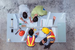 Construction team work, they`re talking about new project. Top view Construction team work, they`re talking about new project. Top view