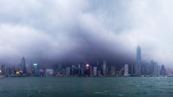 Hong Kong skyline under typhoon attacking. Panoramic view of horrible storm over big city, Hongkong in typhoon disaster more and more due to climate change Hong Kong skyline under typhoon attacking. Panoramic view of horrible storm over big city, Hongkong in typhoon disaster more and more due to climate change