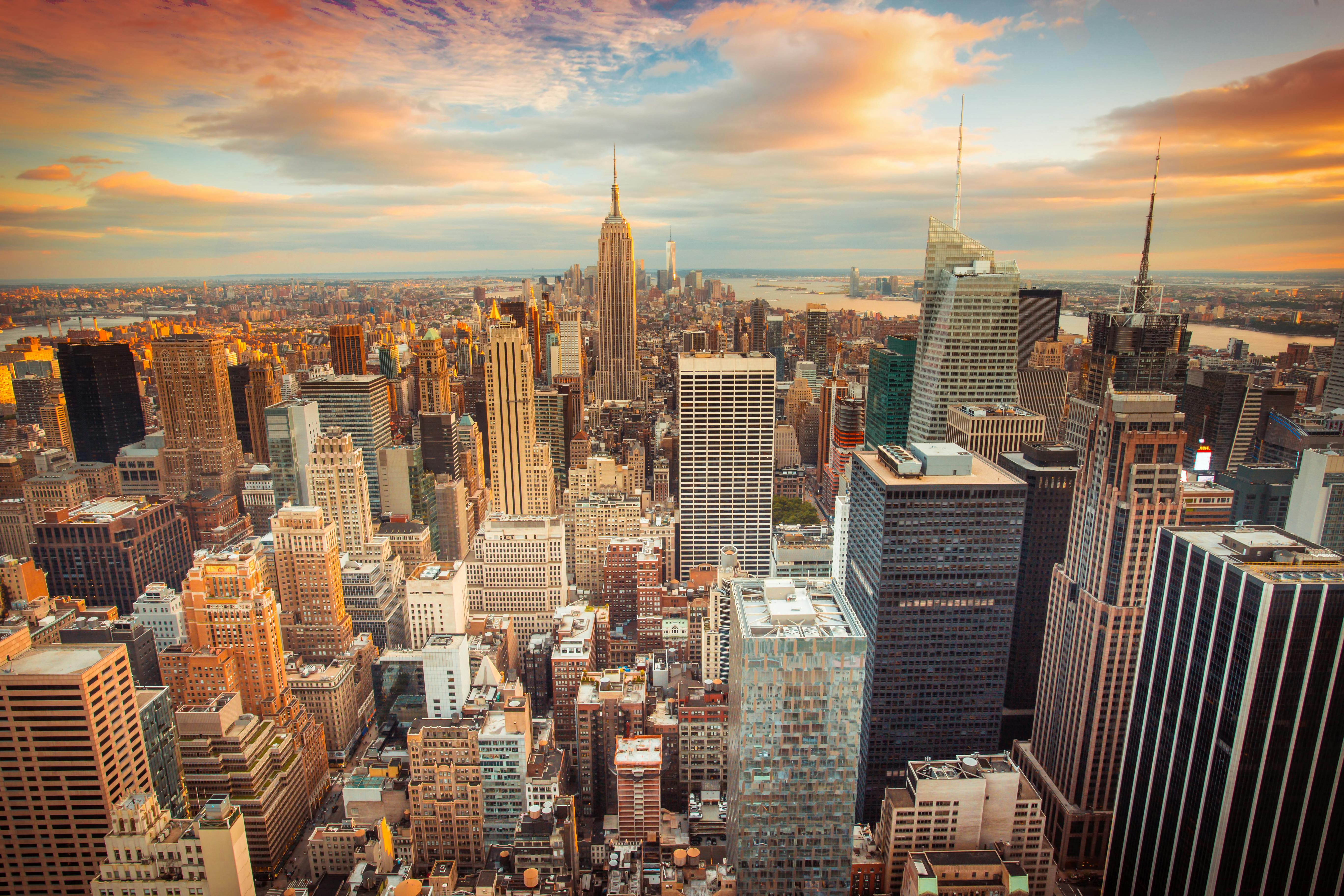 Sunset aerial view of New York City looking over midtown Manhattan towards downtown.