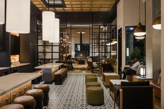 Pictured: The Midland Lofts, Kansas City, Mo. To supplement the apartments’ compact floorplans, Midland Lofts offers community amenities such as a library, co-working space, and coffee bar