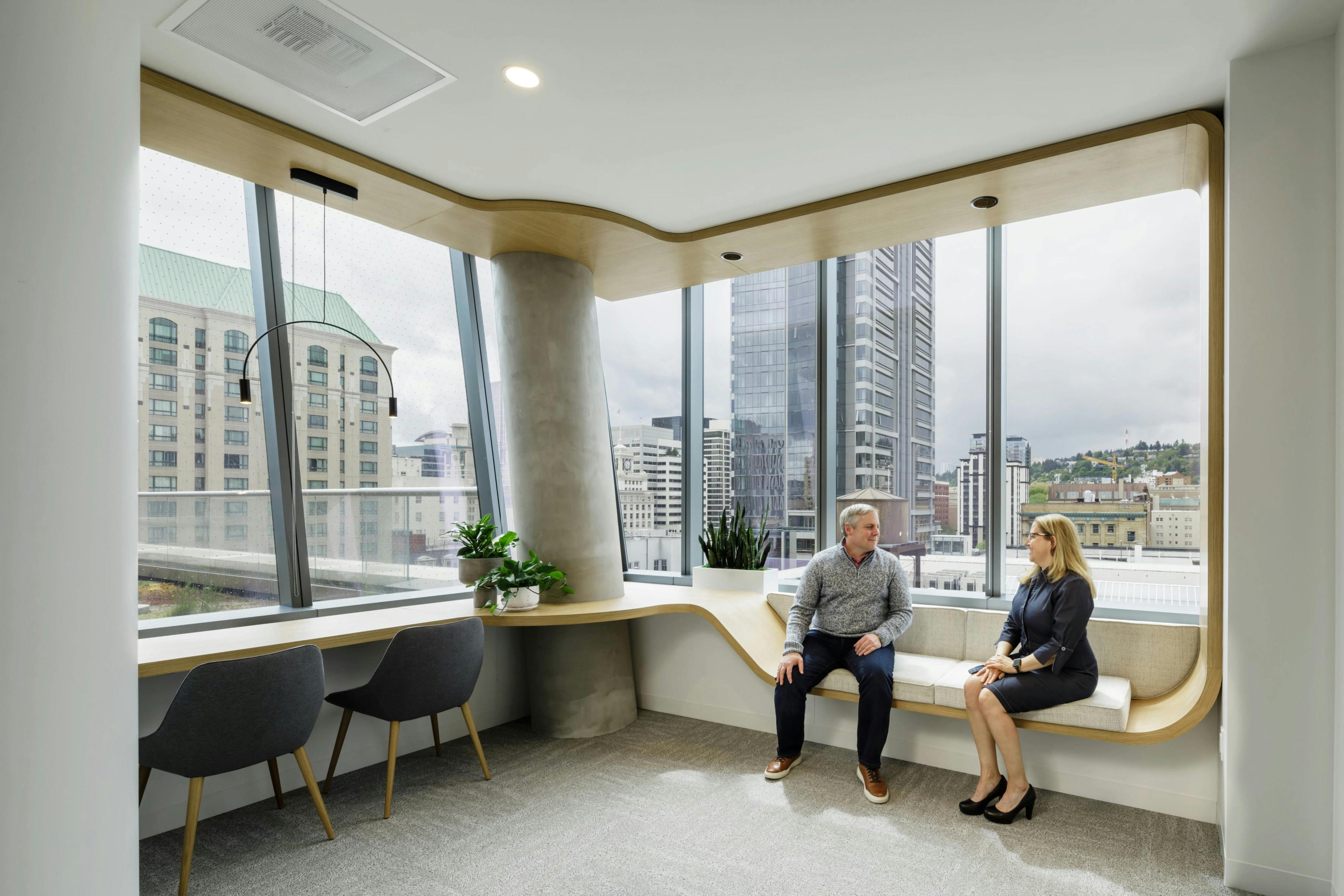 Davis Wright Tremaine, Portland, Ore. Continuous curved wood casework creates both seating and workstations.