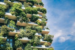 Green futuristic skyscraper close-up architecture. Green futuristic skyscraper Bosco Verticale, vertical forest apartment building with gardens on balconies. Modern sustainable architecture in Porta Nuova district, Milan, Italy. Green futuristic skyscraper close-up architecture. Green futuristic skyscraper Bosco Verticale, vertical forest apartment building with gardens on balconies. Modern sustainable architecture in Porta Nuova district, Milan, Italy.