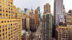 Beautiful landscape view of New York City skyline with high-rise buildings and busy street seen from above. New York. USA.