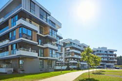 New modern block of flats in green area. residential apartment with flat buildings exterior. luxury house complex. Part of City Real estate property, condo architecture. apartment insurance concept New modern block of flats in green area. residential apartment with flat buildings exterior. luxury house complex. Part of City Real estate property, condo architecture. apartment insurance concept