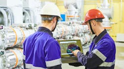 Industrial workers with tablet computer at power energy supply factory Industrial workers with tablet computer at power energy supply factory