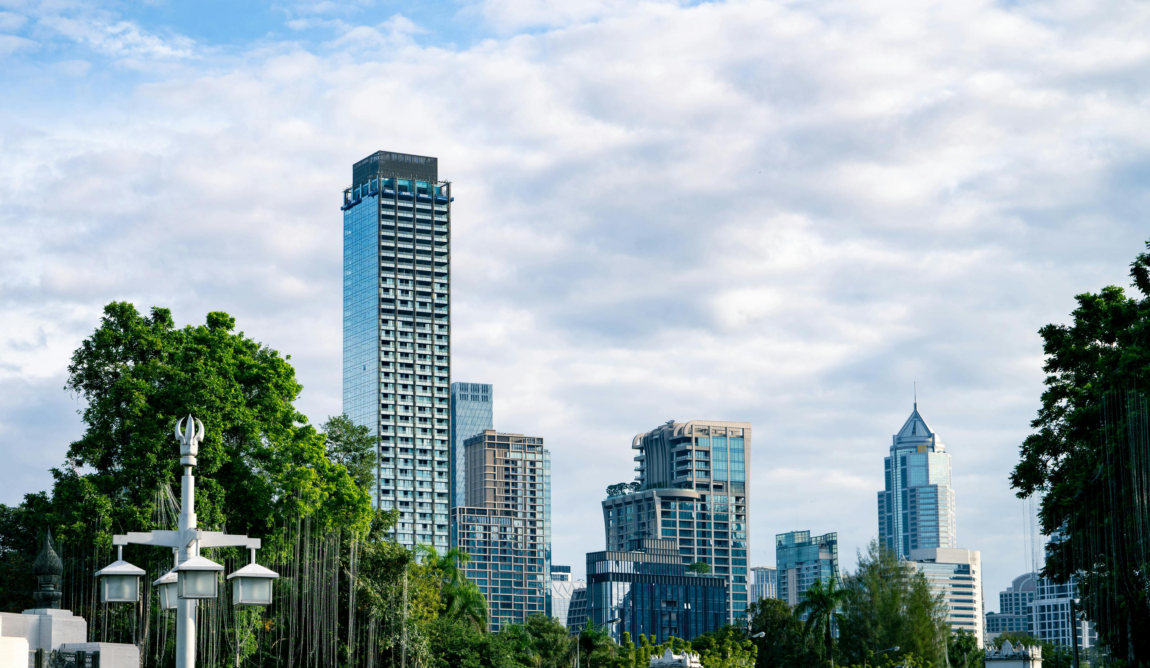 City skyline with modern skyscrapers glass building and greenery. Sustainable urban development. Urban landscape. Balance between city infrastructure, environmental planning, and clean city living
