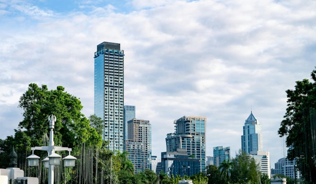 City skyline with modern skyscrapers glass building and greenery. Sustainable urban development. Urban landscape. Balance between city infrastructure, environmental planning, and clean city living