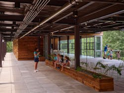 Berks Nature’s covered outdoor roof deck, which overlooks their magnificent wetlands and creek bed, doubles the size of “The Rookery,” their multipurpose learning and event space, whose glass end wall can open completely to seamlessly connect the serene indoor and outdoor environments. Photo courtesy GWWO Berks Nature’s covered outdoor roof deck, which overlooks their magnificent wetlands and creek bed, doubles the size of “The Rookery,” their multipurpose learning and event space, whose glass end wall can open completely to seamlessly connect the serene indoor and outdoor environments. Photo courtesy GWWO