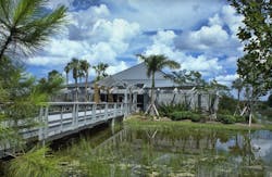 At the Everglades Visitor Center, the new pedestrian bridge that leads from the parking lot to the building entrance becomes part of the interpretive educational journey by engaging visitors in the natural environment. It serves as a physical and mental transition zone between the arrival journey and the educational exhibits inside. Photo courtesy GWWO At the Everglades Visitor Center, the new pedestrian bridge that leads from the parking lot to the building entrance becomes part of the interpretive educational journey by engaging visitors in the natural environment. It serves as a physical and mental transition zone between the arrival journey and the educational exhibits inside. Photo courtesy GWWO