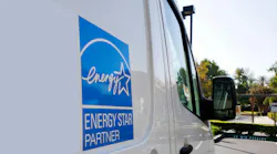 Energy Star sign. The Energy Star logo on the side of a machine repair truck in a parking lot.