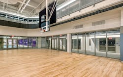 Floor-to-ceiling transparent fire-resistive walls and doors were used to maintain clear visibility across major athletic zones such as the swimming pool and 4-court gym. Photo credit: SAFTI FIRST® Floor-to-ceiling transparent fire-resistive walls and doors were used to maintain clear visibility across major athletic zones such as the swimming pool and 4-court gym. Photo credit: SAFTI FIRST®