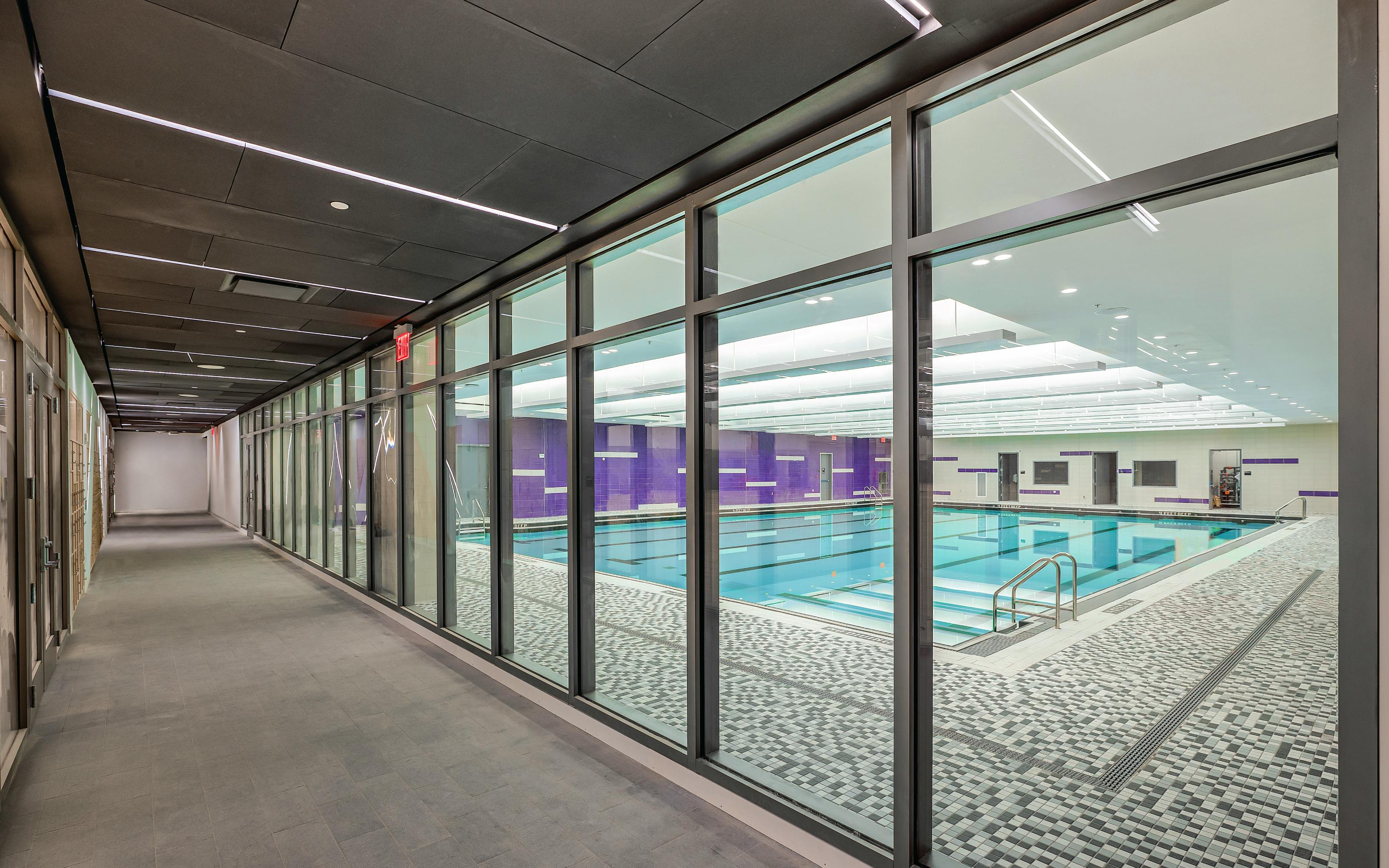 Transparent fire-resistive glass walls were used liberally in the exit corridors in the underground levels to achieve code compliance, spatial openness and enhanced wayfinding. Photo credit: SAFTI FIRST&circledR;