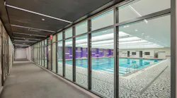 Transparent fire-resistive glass walls were used liberally in the exit corridors in the underground levels to achieve code compliance, spatial openness and enhanced wayfinding. Photo credit: SAFTI FIRST®