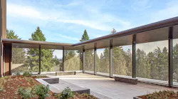Metal mesh panels were used to safely restrict access and enclose an interior courtyard at the University of Washington Behavioral Health Center. Image courtesy of GKD-USA
