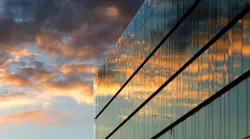 Modern Office Building. Modern glass office building with sunset reflection