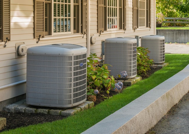 Heating and air conditioning units in back of an apartment complex