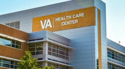 Veterans Administration Health Care Center. Horizontal, medium closeup of VA Health Care Center medical facilities exterior facade brand and logo signage adorning the modern architecture of the building in Charlotte, North Carolina with floors of reflective windows and a clear blue sky in the soft light of early morning. Veterans Administration Health Care Center. Horizontal, medium closeup of VA Health Care Center medical facilities exterior facade brand and logo signage adorning the modern architecture of the building in Charlotte, North Carolina with floors of reflective windows and a clear blue sky in the soft light of early morning.
