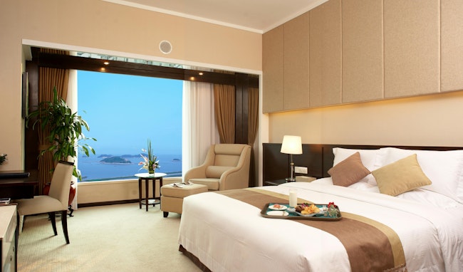 Hotel bed room. A seaview of a modern bed room in a hotel in China