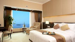 Hotel bed room. A seaview of a modern bed room in a hotel in China Hotel bed room. A seaview of a modern bed room in a hotel in China