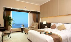 Hotel bed room. A seaview of a modern bed room in a hotel in China Hotel bed room. A seaview of a modern bed room in a hotel in China