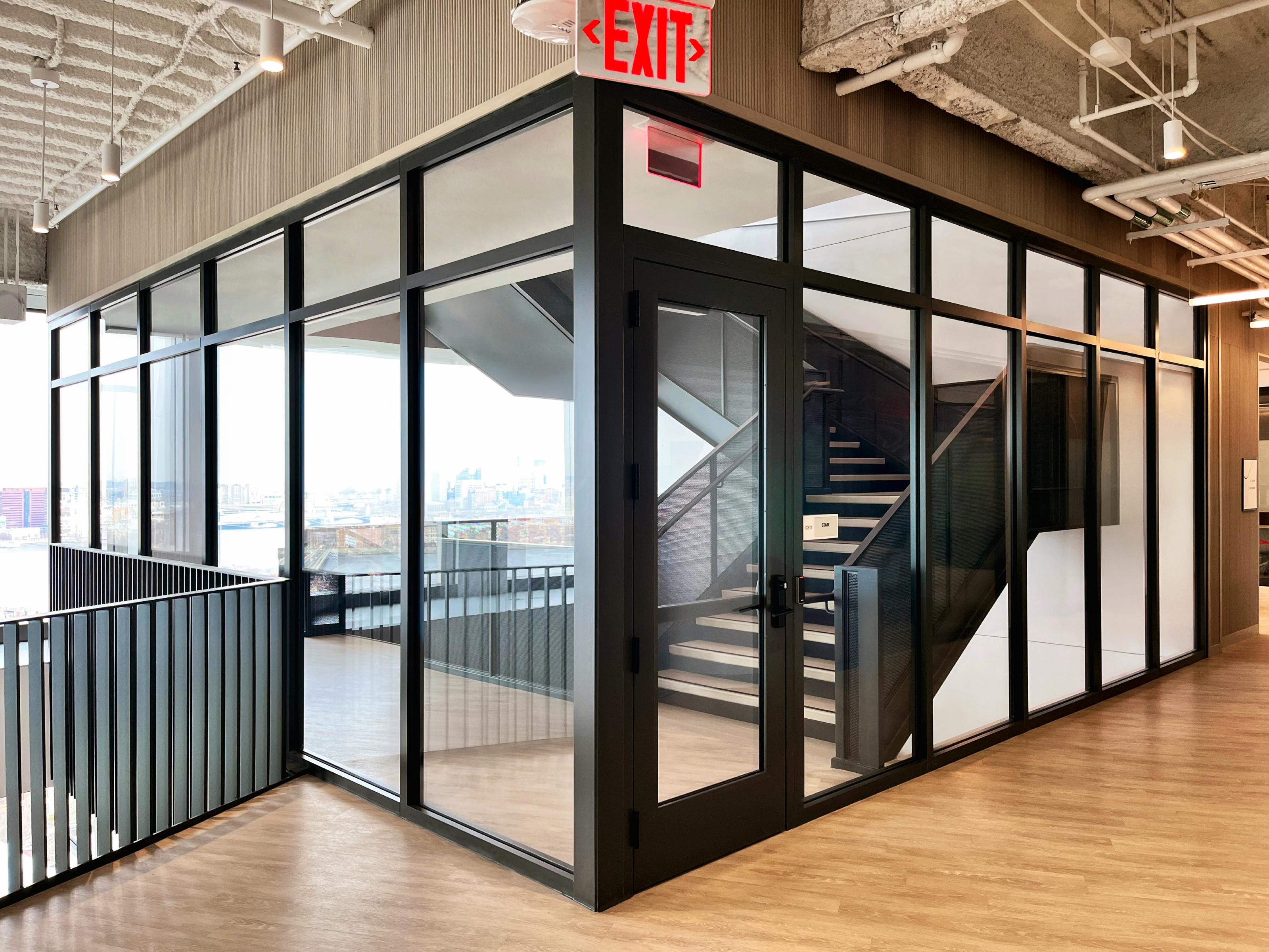 The transparent, light-filled 2-hour stairwell at CarGurus HQ provides openness and visibility across the building&rsquo;s top 10 floors. The assembly supports the connected design intent while meeting 2-hour fire-resistance and life safety code requirements.