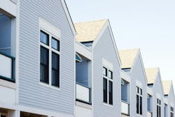 Houses in a row. A row of new affordable housing construction Houses in a row. A row of new affordable housing construction