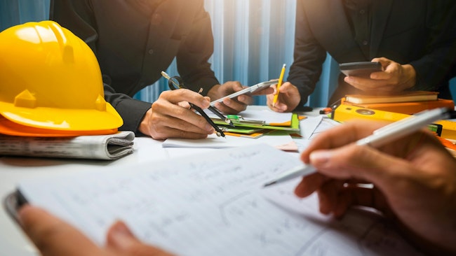 Teamwork of business man contractor working meeting in the office construction site on their architect project.
