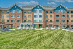 Outdoor grass area in modern senior living facility Outdoor grass area in modern senior living facility