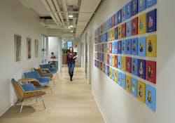 The central connecting hallway features the firm’s “We Wall,” where each employee customizes a cultural classic—the rubber duck—as a unique expression of individuality displayed alongside their colleagues, celebrating the spirit of One Team The central connecting hallway features the firm’s “We Wall,” where each employee customizes a cultural classic—the rubber duck—as a unique expression of individuality displayed alongside their colleagues, celebrating the spirit of One Team