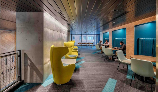 The Arcadia Flats study lounge at Western Michigan University features study pods with an abundance of outlets and bright design colors